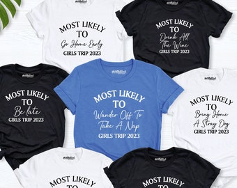 May include: Seven white t-shirts with black text that reads "Most Likely To" followed by a funny phrase. The phrases are: "Go Home Early", "Drink All The Wine", "Be Late", "Wander Off To Take A Nap", "Bring Home A Stray Dog", "Kiss A Stranger", "Party All Night". All shirts have the text "Girls Trip 2023" at the bottom.