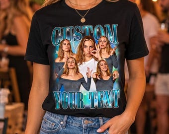 May include: A black short-sleeved t-shirt featuring a graphic print with the text CUSTOM and YOUR TEXT in a metallic blue font. The design includes multiple images of the same person in various poses against a blue lightning background.