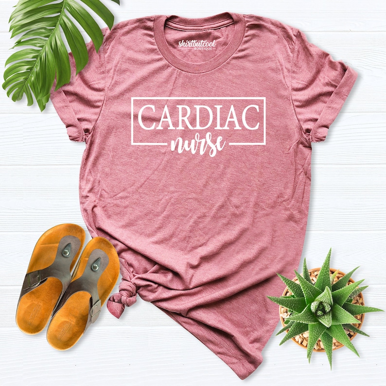 May include: A pink t-shirt with the text "CARDIAC nurse" in a white box.