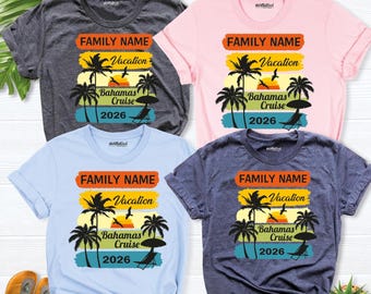 May include: Four short-sleeve t-shirts in dark gray, light pink, light blue, and navy blue. Each shirt features a graphic with the text FAMILY NAME, Vacation, Bahamas Cruise, and 2026, alongside palm trees, a sun, and a beach chair.