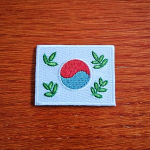 Belaubter kleiner Bügelbild der koreanischen Flagge