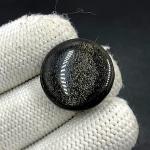 Goudglanzend obsidiaan cabochon...Ronde cabochon...23 x 4 mm...16 kt...A#N5465