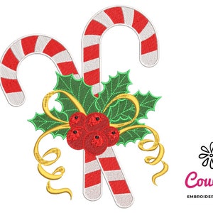 May include: Two red and white candy canes with green holly leaves and red berries, tied with a gold ribbon.  The design is perfect for Christmas embroidery.