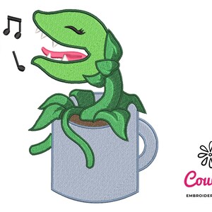 May include: A green singing plant with a pink mouth and eyelashes in a gray coffee mug. The plant is singing with musical notes above it and a pink heart to the left. The text "CouCou Embroidery Designs" is in the lower right corner.