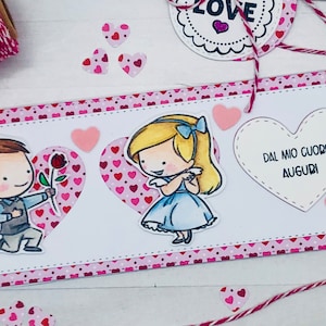 LOVE IS…,biglietto di auguri fatto a mano con dolce coppia innamorata colorata a mano con acquerelli per San Valentino,amore,anniversario