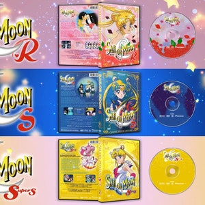 May include: Three DVD cases featuring Sailor Moon The Movie R, Sailor Moon The Movie S, and Sailor Moon The Movie Super S. Each case has a pink, blue, and yellow background with a crescent moon and stars. The DVD cases are next to a DVD disc with a pink, blue, and yellow background.