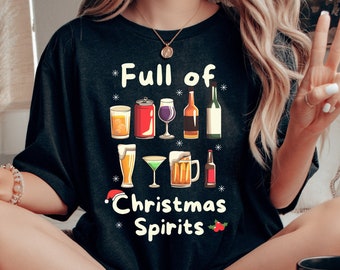 May include: A black t-shirt with the text "Full of Christmas Spirits" and a graphic of various alcoholic beverages, including beer, wine, and cocktails.