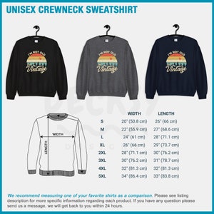 May include: A unisex crewneck sweatshirt in black, gray, and blue with a vintage-style graphic that says "I'm not old, I'm vintage". The sweatshirt is available in sizes S-5XL. The size chart shows the width and length of the sweatshirt in inches and centimeters.