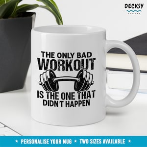 May include: White ceramic mug with a black graphic that reads "The only bad workout is the one that didn't happen." The graphic also features a black barbell with weights on each end.