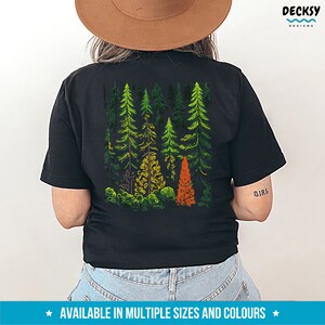 May include: Black t-shirt with a graphic print of a forest scene with green and orange trees. The text "Girl" is printed on the right sleeve.