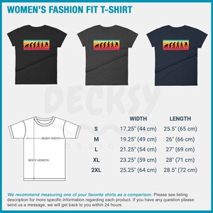 May include: Three women's fashion fit t-shirts in black, charcoal, and navy blue. Each shirt features a rectangular graphic with an evolution of a skateboarder design in orange, yellow, and red. Measurements are provided for width and length.