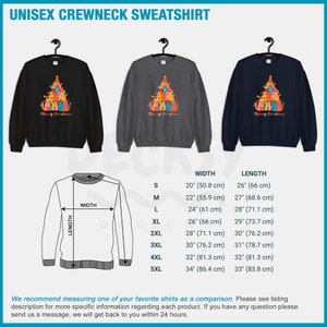 May include: A unisex crewneck sweatshirt with a Christmas tree design featuring cats. The sweatshirt is available in black, gray, and navy blue. The text "Merry Christmas" is printed on the front of the sweatshirt. The size chart shows the width and length of the sweatshirt in inches and centimeters.