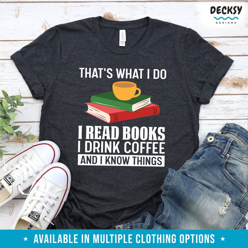 May include: A dark gray t-shirt with the text "That's what I do I read books I drink coffee and I know things" in white. A cartoon image of a cup of coffee and a stack of books is above the text.