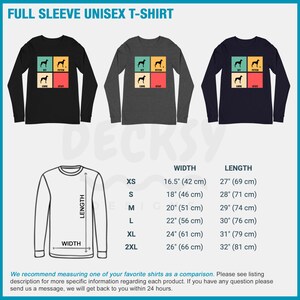 May include: A black, heather grey, and navy blue long-sleeved t-shirt with a retro-style graphic of a dog with the words "Sit", "Fetch", "Come", and "Stay". The t-shirt is available in sizes XS to 2XL. The size chart shows the width and length of the shirt in inches and centimeters.