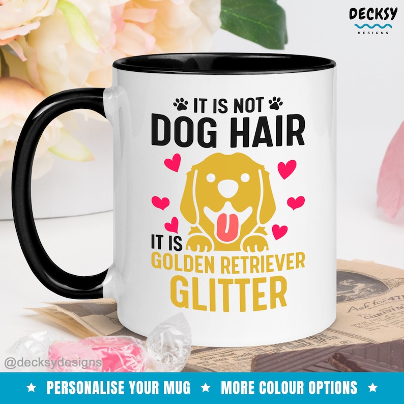 May include: White ceramic coffee mug with a black rim and handle. The mug features a golden retriever dog illustration with the text "It is not dog hair, it is golden retriever glitter".