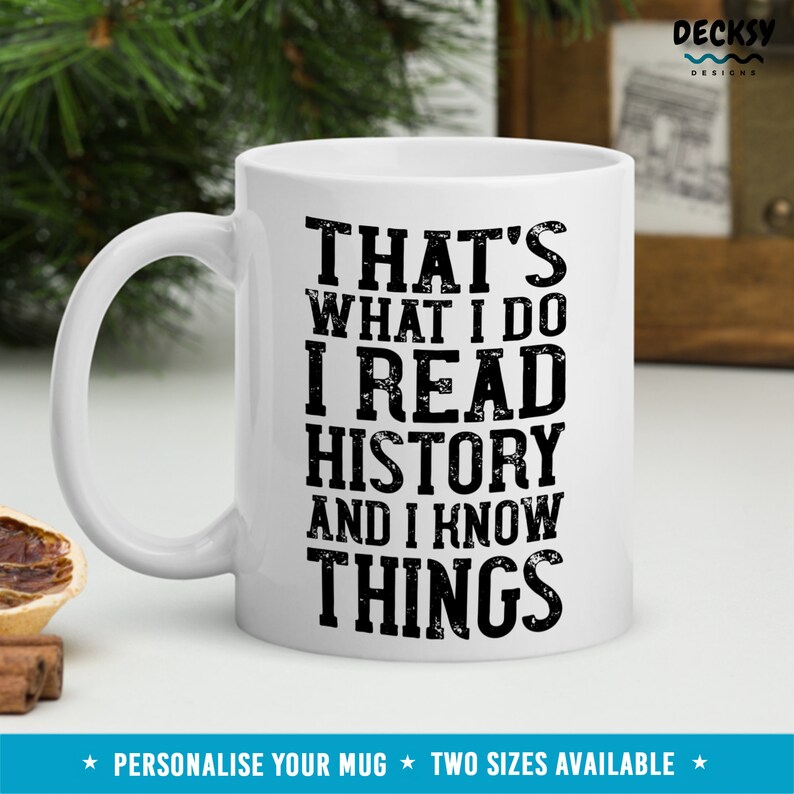 May include: White ceramic mug with black text that reads "That's what I do I read history and I know things".