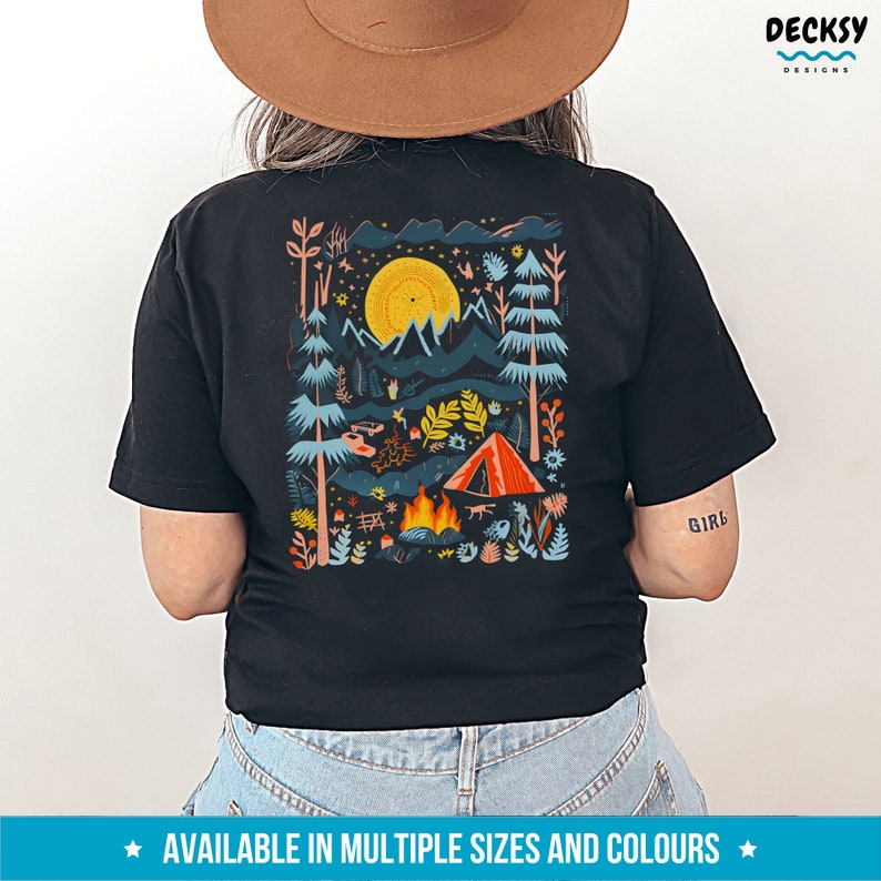 May include: Black t-shirt with a colorful illustration of a campsite scene with a tent, campfire, and trees. The text "Girl" is printed on the right sleeve.