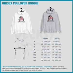 Puede incluir: Una sudadera con capucha unisex con un gr&aacute;fico de una rosquilla de dibujos animados corriendo con el texto "Will Run For Donuts". La sudadera con capucha est&aacute; disponible en blanco y gris. La tabla de tallas muestra el ancho y la longitud de la sudadera con capucha en pulgadas y cent&iacute;metros.