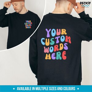 May include: Black sweatshirt with a colorful "YOUR CUSTOM WORDS HERE" graphic on the back. The text is in a retro, bubble-letter style.
