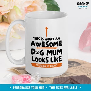May include: White ceramic mug with a black and orange design that says "This is what an awesome dog mum looks like. Certified by Bruno."