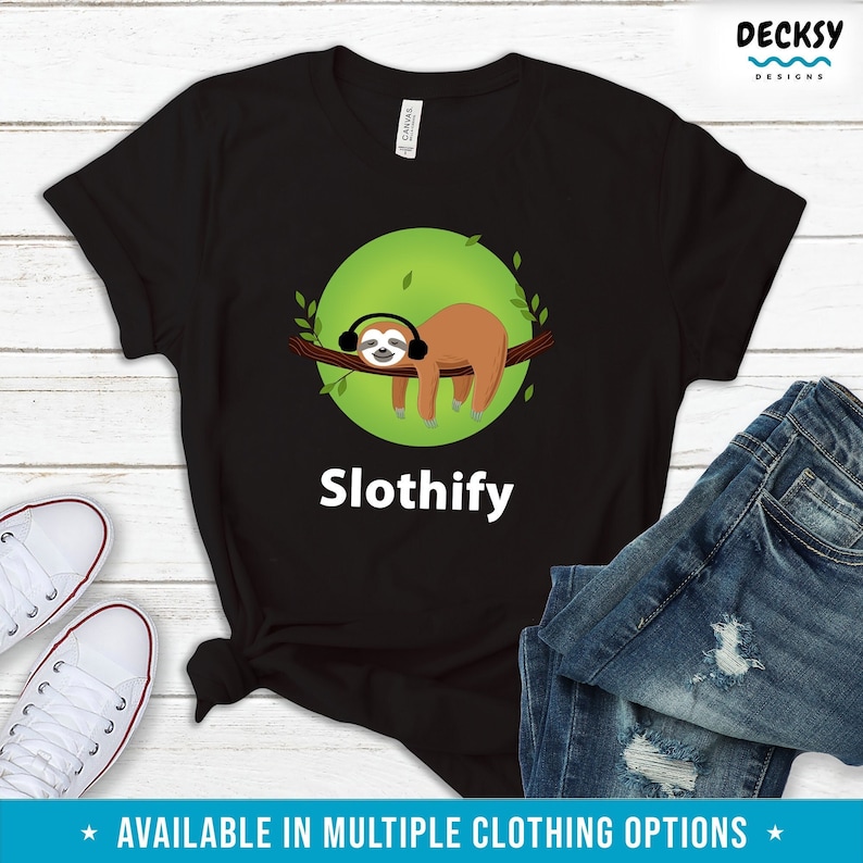 May include: Black t-shirt with a green circle and a cartoon sloth wearing headphones. The text "Slothify" is printed below the sloth.