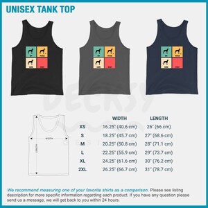 May include: A unisex tank top with a retro-style design featuring a dog silhouette and the words "Sit, Fetch, Come, Stay". The tank top is available in black, gray, and navy blue. The size chart shows the width and length measurements in inches and centimeters.