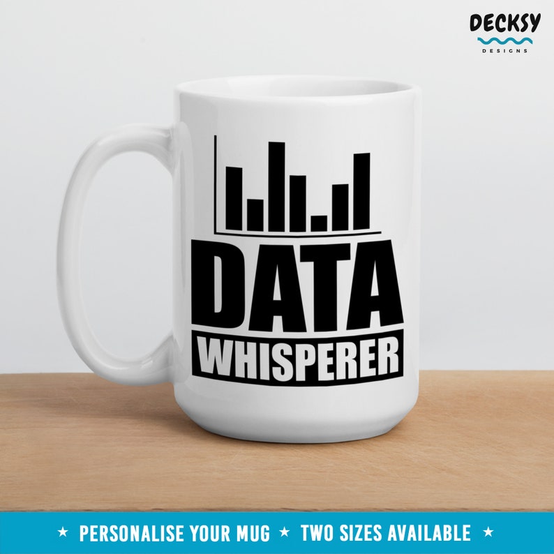 May include: White ceramic mug with a black graphic of a bar chart and the text "DATA WHISPERER".