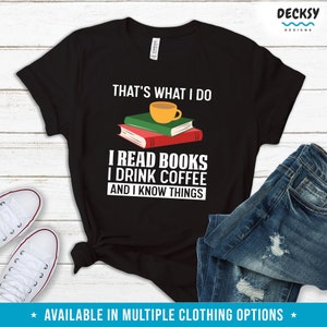 May include: Black t-shirt with white text that reads "That's what I do I read books I drink coffee and I know things". A stack of books with a cup of coffee on top is illustrated above the text.