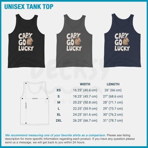 May include: A unisex tank top with a graphic of a capybara wearing a hat and the text "CAPY GO LUCKY". The tank top is available in black, gray, and navy blue. The size chart shows the width and length measurements in inches and centimeters.