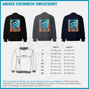 May include: A unisex crewneck sweatshirt with a graphic of two orcas swimming in a kelp forest. The sweatshirt is available in black, gray, and navy blue. The size chart shows the width and length of the sweatshirt in inches and centimeters.