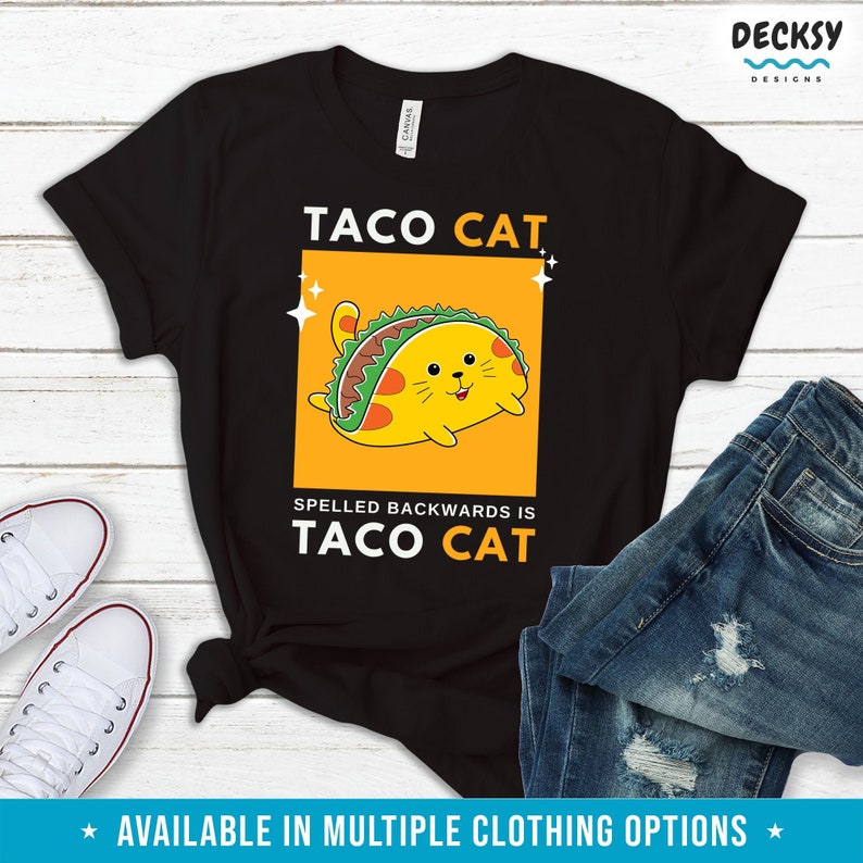 May include: Black t-shirt with a yellow cat wearing a taco. The text "Taco Cat" is above the cat and the text "Spelled backwards is Taco Cat" is below the cat.