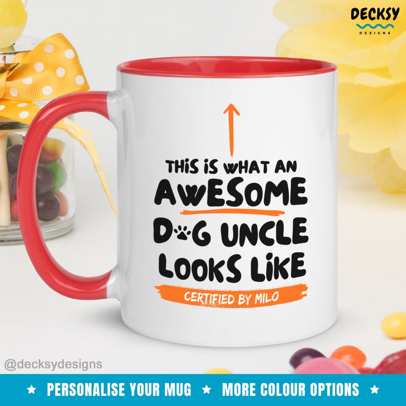 May include: White ceramic mug with a red rim and handle. The mug has a black and orange design that says "This is what an awesome dog uncle looks like. Certified by Milo."