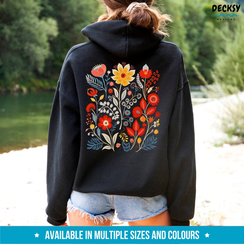 May include: Black hooded sweatshirt with a colorful floral design on the back. The design features red, yellow, blue, and green flowers.
