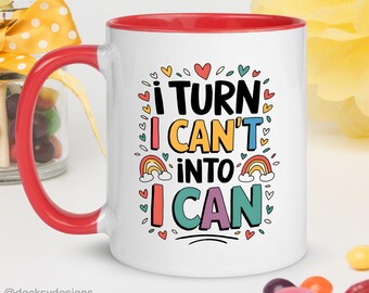 May include: White ceramic mug with a red rim and handle. The mug features a colourful graphic with the text "I turn I can't into I can".