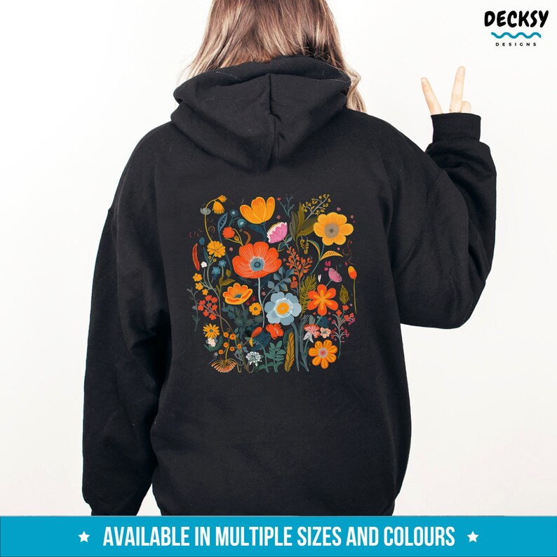 May include: Black hoodie with a colorful floral print on the back. The print features a variety of flowers in shades of orange, yellow, red, blue, and green.