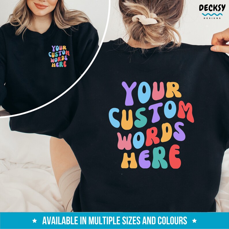 May include: Black sweatshirt with "YOUR CUSTOM WORDS HERE" in colorful, wavy letters. The text is on the back of the sweatshirt. The sweatshirt is available in multiple sizes and colors.