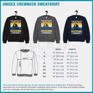 May include: A unisex crewneck sweatshirt with a vintage sunset graphic and the text "Sorry for what I said when I was docking the boat". The sweatshirt is available in black, grey, and navy blue. Size chart with width and length measurements in inches and centimeters.
