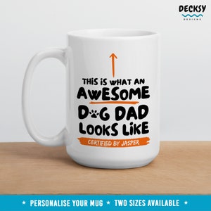 May include: White ceramic mug with a black and orange design that says "This is what an awesome dog dad looks like. Certified by Jasper".
