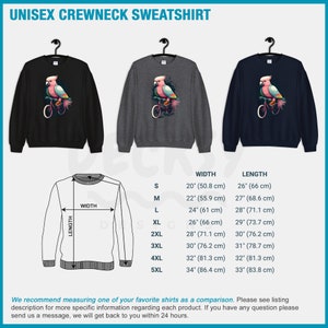 May include: Unisex crewneck sweatshirt with a pink cockatoo riding a bicycle graphic. The sweatshirt is available in black, heather grey, and navy blue. Size chart with width and length measurements in inches and centimeters.