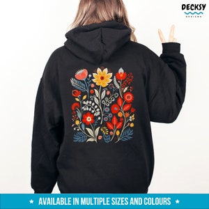May include: Black hoodie with a colorful floral design on the back. The design features red, yellow, blue, and green flowers and leaves.