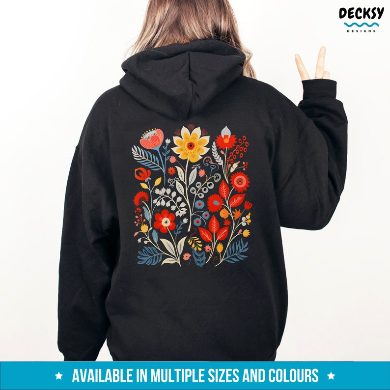 May include: Black hoodie with a colorful floral design on the back. The design features red, yellow, blue, and green flowers and leaves.