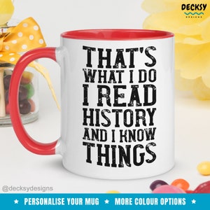 May include: White ceramic mug with a red rim and handle. The mug has black text that reads "That's what I do I read history and I know things".