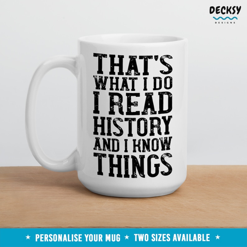 May include: White ceramic mug with black text that reads "That's what I do I read history and I know things".