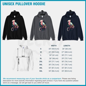 May include: Unisex pullover hoodie with a graphic of a pink cockatoo riding a bicycle. The hoodie is available in black, gray, and navy blue. Size chart with width and length measurements in inches and centimeters.