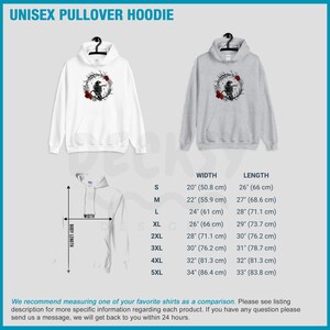 May include: White and gray unisex pullover hoodies with a crow and floral design. The hoodies have a drawstring hood and a front pocket. The image also includes a size chart with measurements in inches and centimeters.