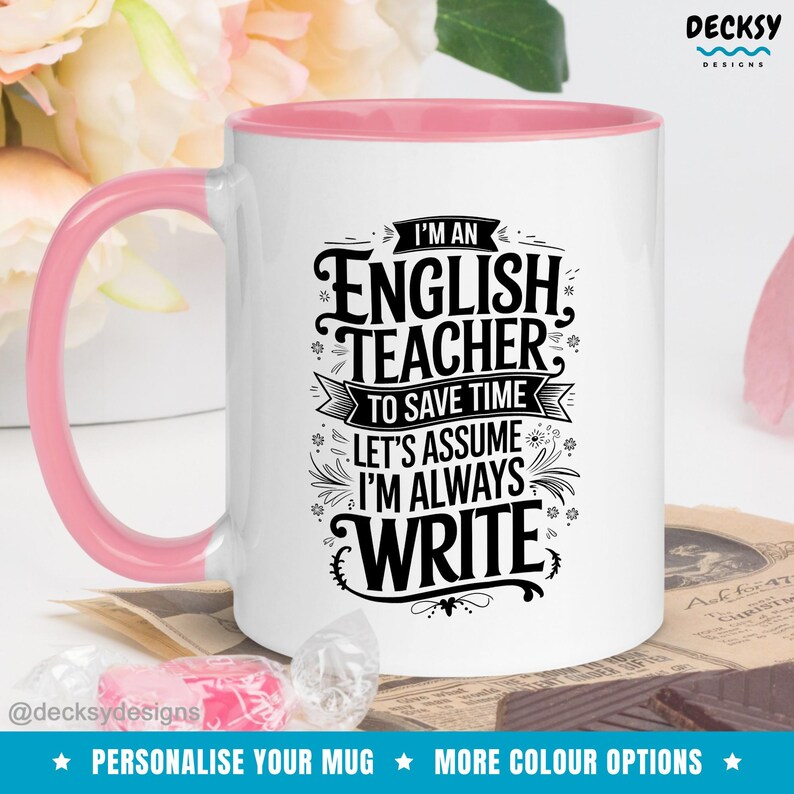 May include: White ceramic mug with a pink rim. The mug features a black and white graphic design that says "I'm an English Teacher. To save time let's assume I'm always write".