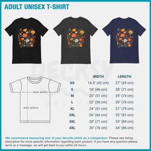 May include: A unisex t-shirt with a floral print in shades of orange, yellow, pink, and blue. The shirt is available in black, heather grey, and navy blue. The size chart shows the width and length of the shirt in inches and centimeters.