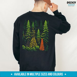May include: Black sweatshirt with a colorful graphic of a forest on the back. The graphic features green, yellow, and orange trees.
