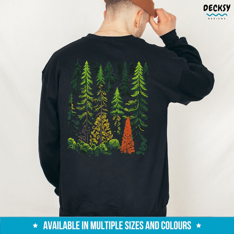 May include: Black sweatshirt with a colorful graphic of a forest on the back. The graphic features green, yellow, and orange trees.