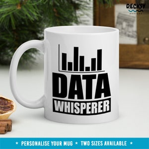 May include: White ceramic mug with a black graphic of a bar chart and the text "DATA WHISPERER".